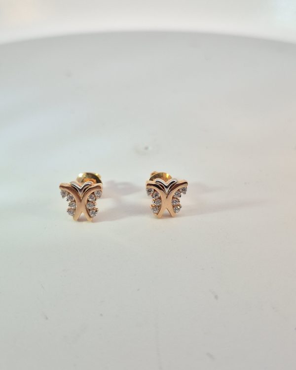 JAINIKA Celeste Crystal Butterfly Stud Earrings — styled view