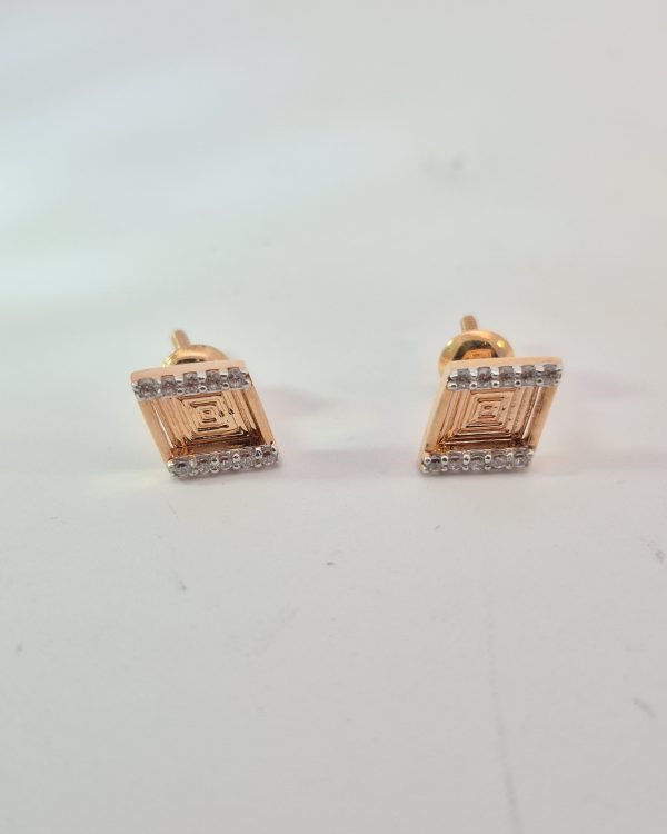 JAINIKA Geometric Radiance Rose Gold Stud Earrings — styled view