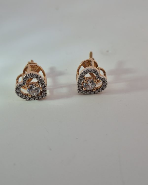 JAINIKA Eternal Heart Crystal Stud Earrings — styled view